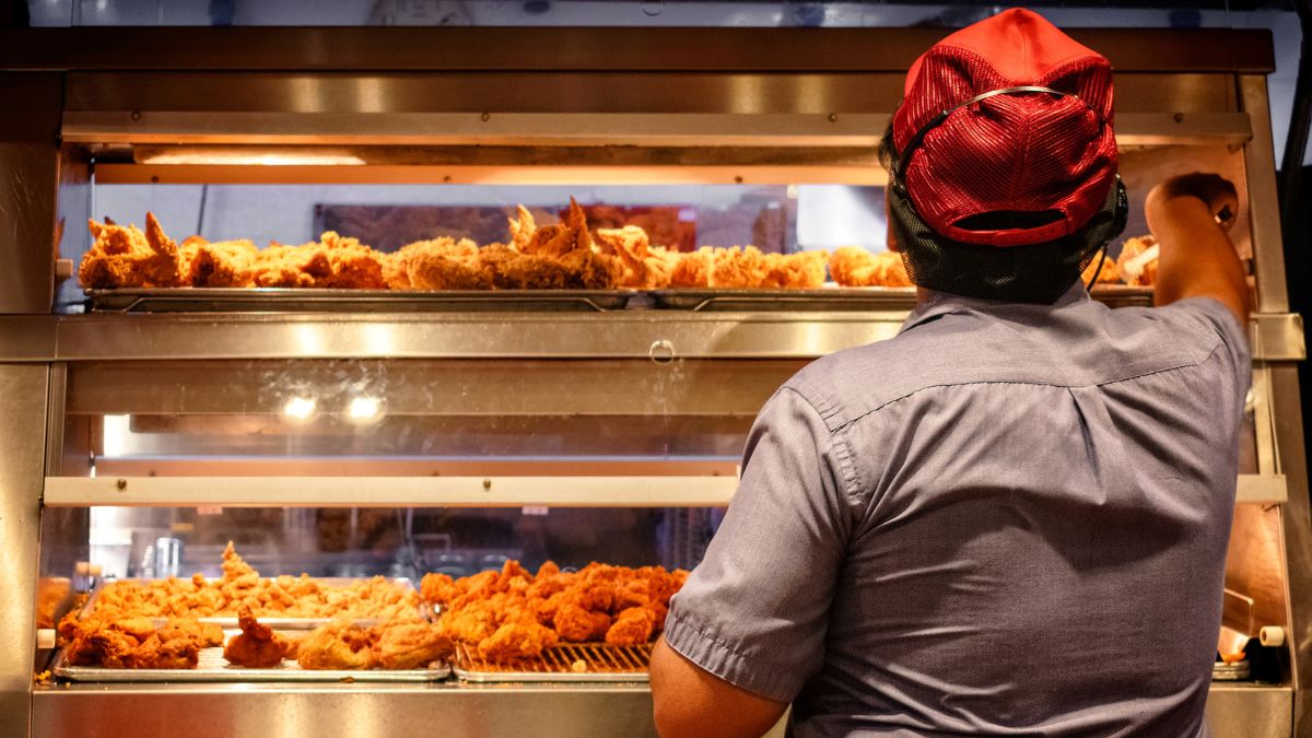 Restaurant worker at fried chicken stand