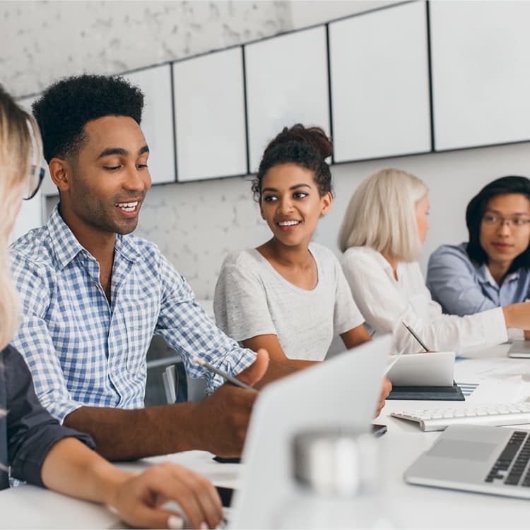 Coworkers sitting in a meeting together