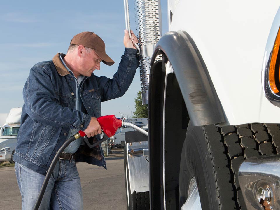 Driver fueling up his truck