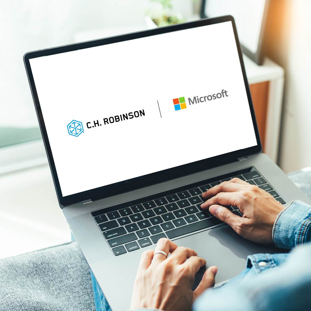 Microsoft | C.H. Robinson lockup logos on a laptop