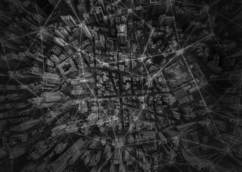 City overview with digital lines pin pointing locations.