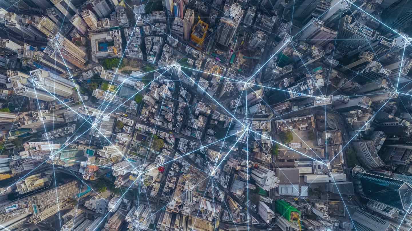 City overview with digital lines pin pointing locations.