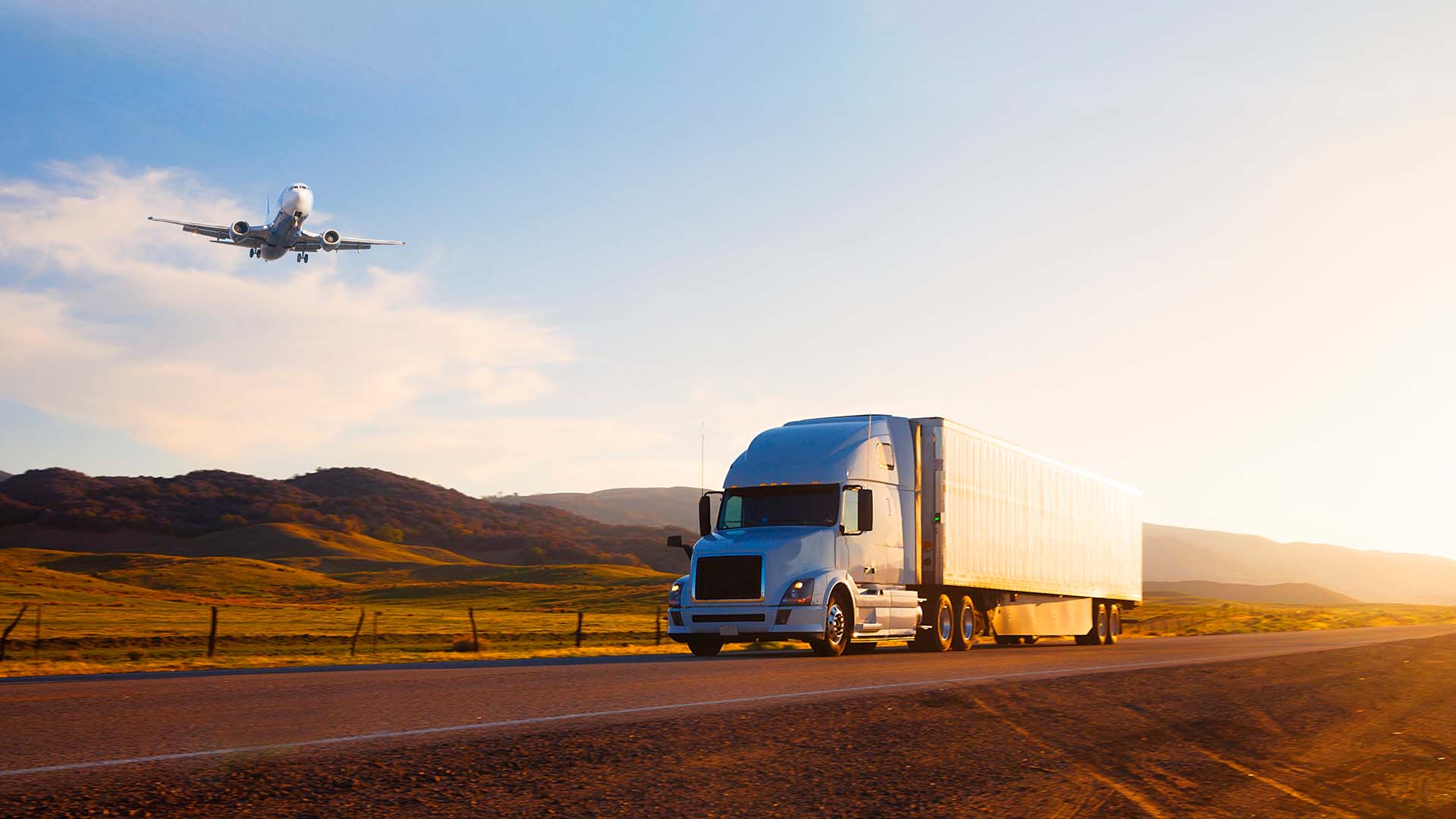 Truck on the road and cargo plane providing freight brokerage services